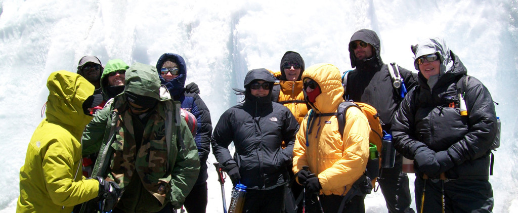 group in front of glacier
